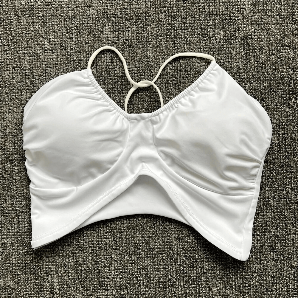 White sexy women's sports bra with open back and deep neckline, designed for comfort and support in activities. Model SF1773.